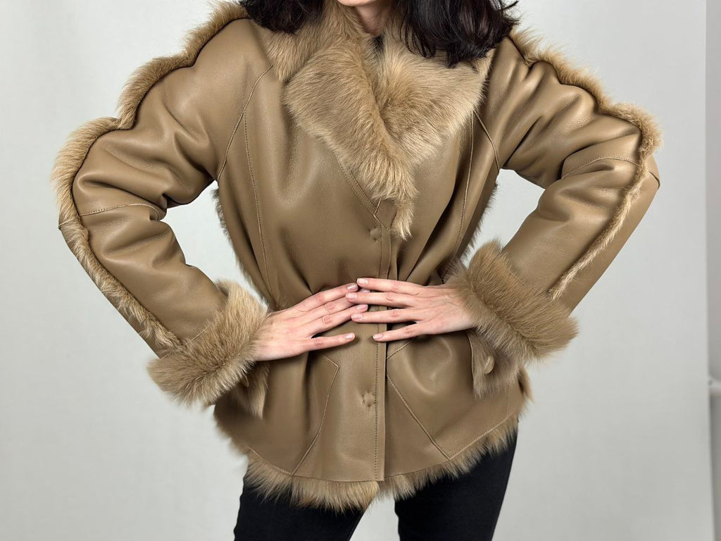 Beige women’s sheepskin coat with a fur collar