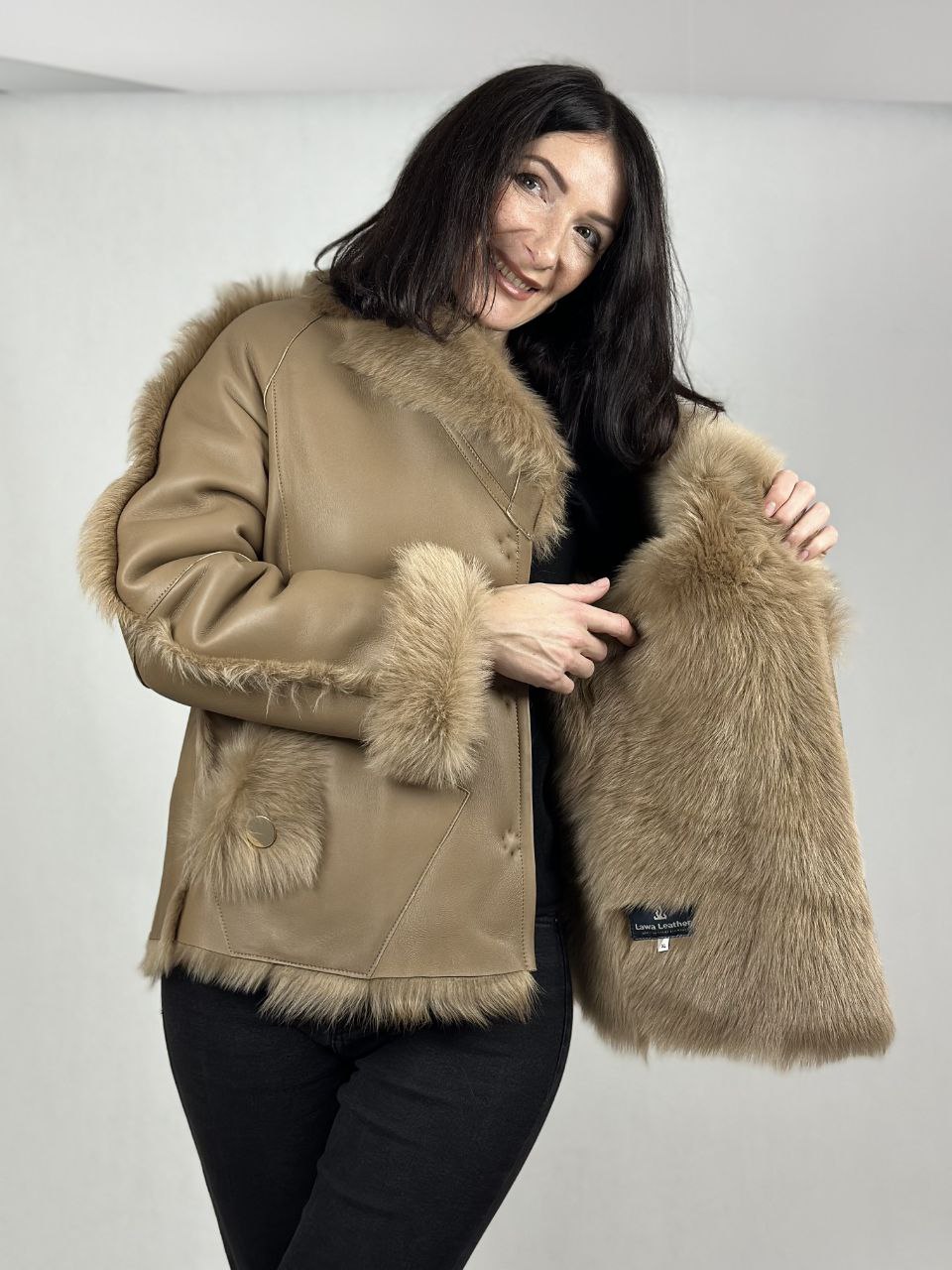 Beige women’s sheepskin coat with a fur collar